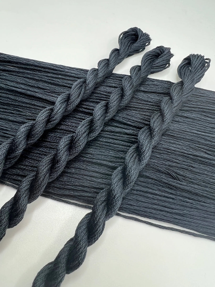 Gray braided yarn on a white background