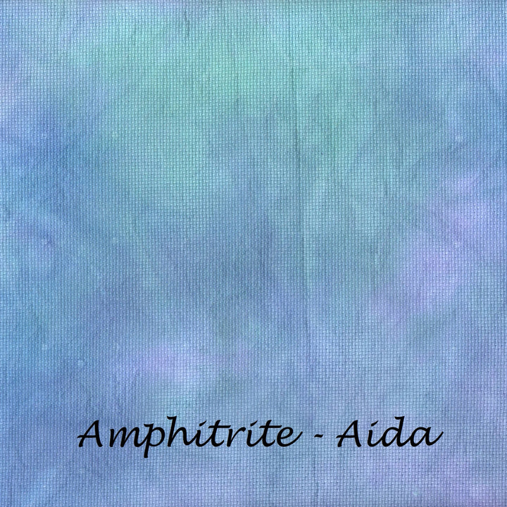 A square fabric swatch with a mottled, tie-dye-like texture in shades of light blue, lavender, and mint green, with the text 'Amphitrite - Aida' printed in black at the bottom.