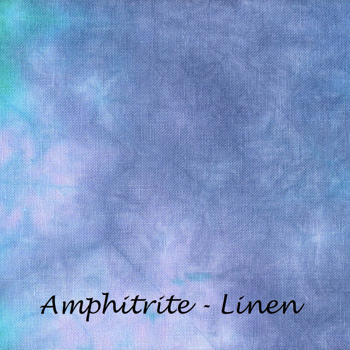 A close-up of a linen fabric with a mottled amphibrite pattern in shades of blue, purple, and green, with the text 'Amphitrite - Linen' written in black script at the bottom.