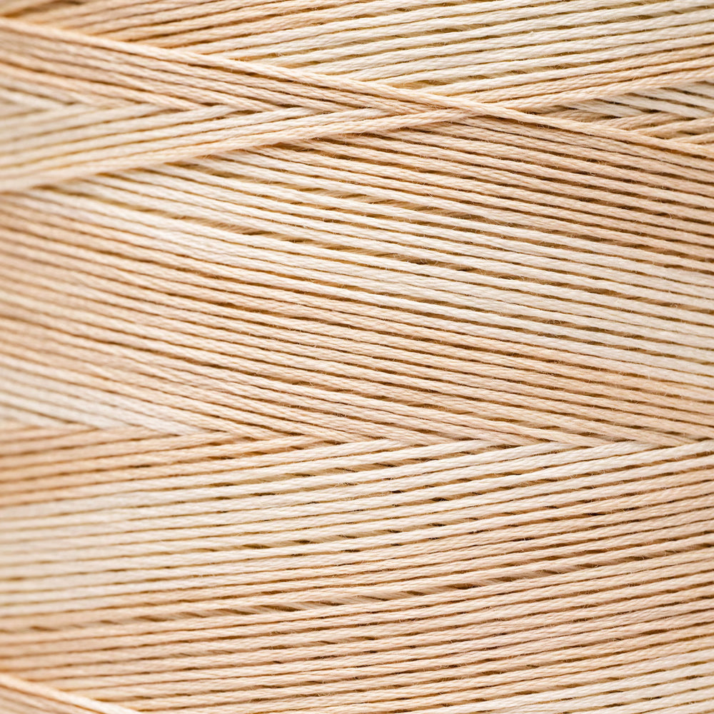 A close-up texture shot of light beige braided thread or cord, showing the fine strands woven in a diagonal pattern.