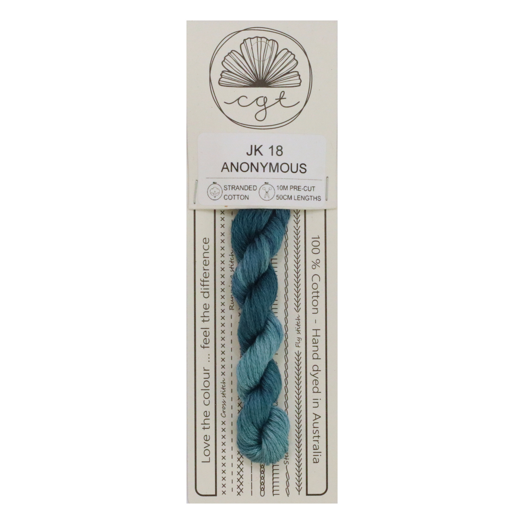 A skein of hand-dyed blue cotton cross stitch and embroidery floss, pre-cut and labeled as Anonymous by Cottage Garden Threads.
