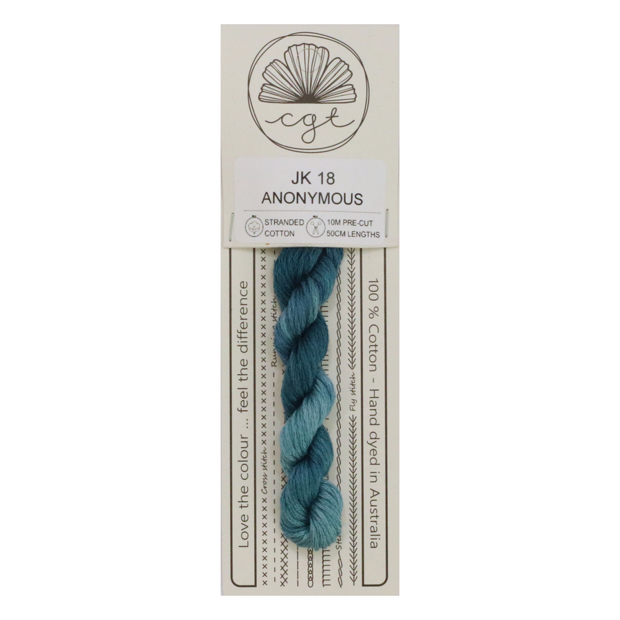 A skein of hand-dyed blue cotton cross stitch and embroidery floss, pre-cut and labeled as Anonymous by Cottage Garden Threads.