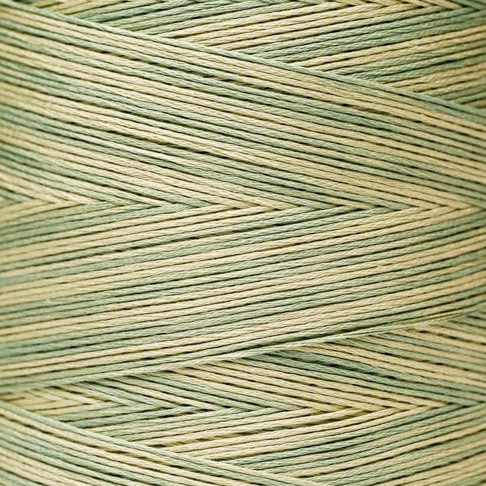 A close-up of textured yarn wound in a herringbone pattern, featuring alternating stripes of sage green and light beige.