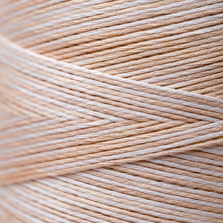 Close-up of beige and white thread strands
