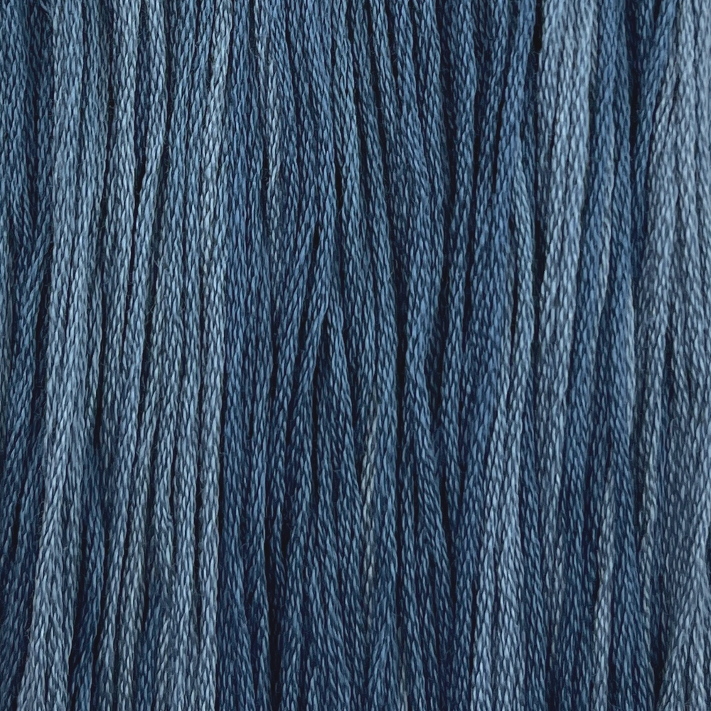 a medium blue cotton embroidery thread with light variegation hand dyed by colour and cotton