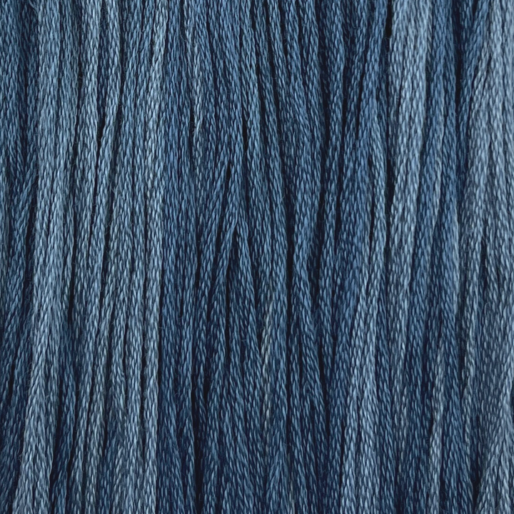 a medium blue cotton embroidery thread with light variegation hand dyed by colour and cotton