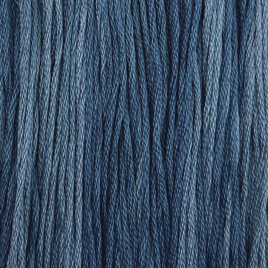 a medium blue cotton embroidery thread with light variegation hand dyed by colour and cotton