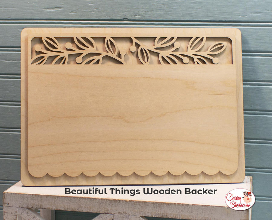 Wooden backer with laser-cut design on a gray background, featuring 'Beautiful Things Wooden Backer' branding.