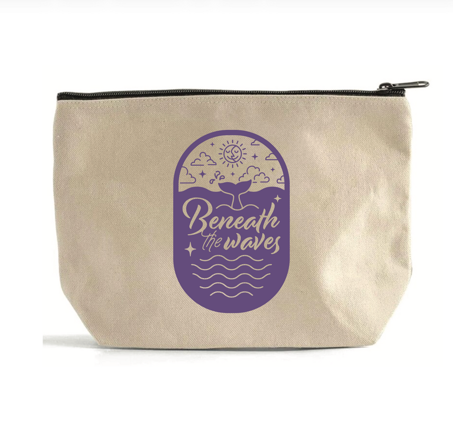 Beige pouch with purple graphic and text 'Beneath the Waves' on a white background