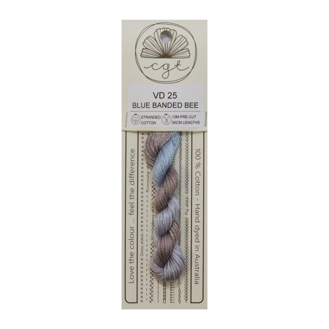 Packaged embroidery with light blue and puprle-brown bands on a white background