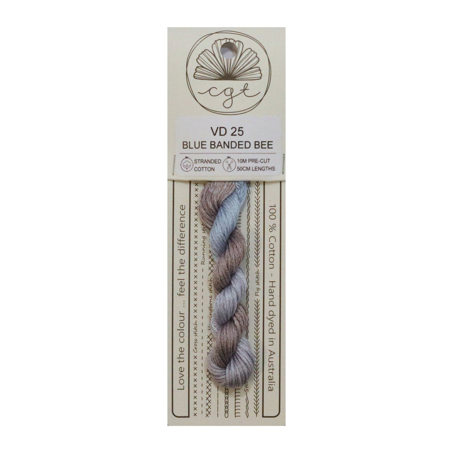 Packaged embroidery with light blue and puprle-brown bands on a white background