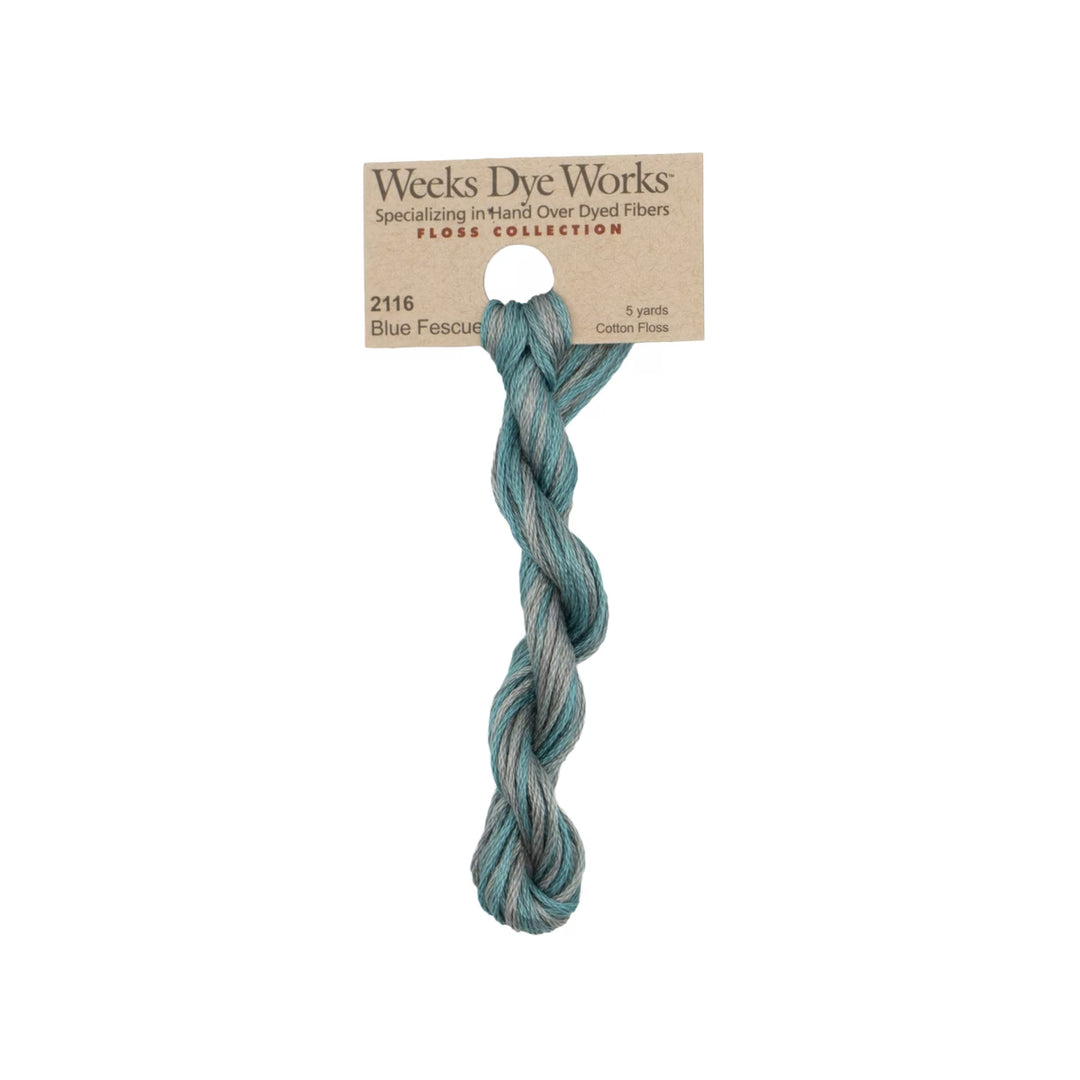 A single twisted hank of Weeks Dye Works Floss Collection cotton fiber in shade 2116 Blue Fescue, attached to its kraft paper header card, shown against a plain white background.