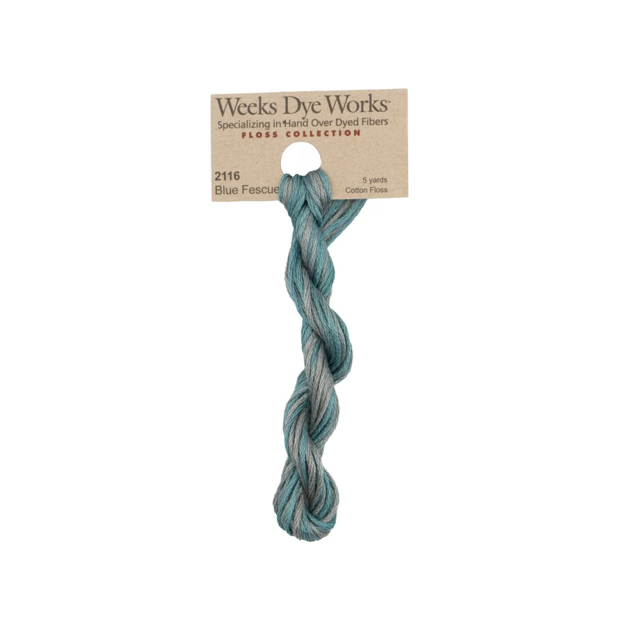 A single twisted hank of Weeks Dye Works Floss Collection cotton fiber in shade 2116 Blue Fescue, attached to its kraft paper header card, shown against a plain white background.