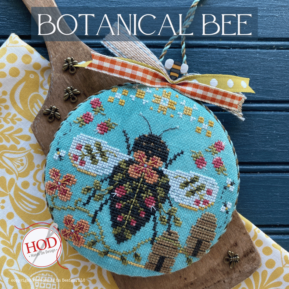 Embroidered bee design on a blue background with 'BOTANICAL BEE' text and HOD logo.