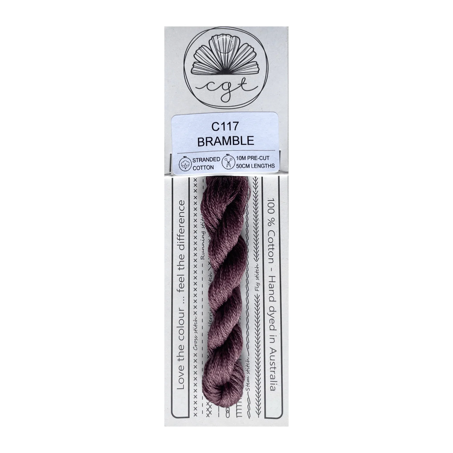 Packaged yarn with a label indicating brand and product details on a white background