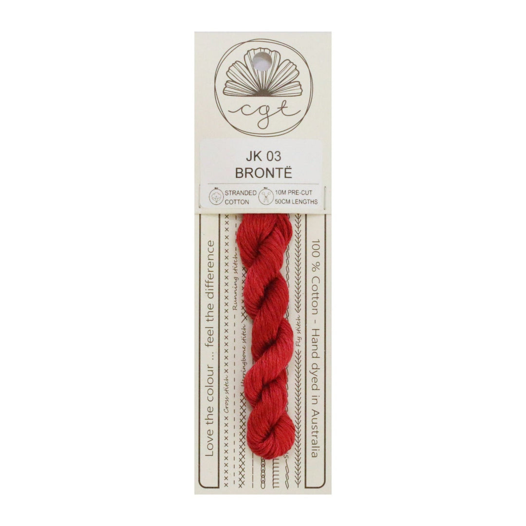 A skein of red Cottage Garden Threads pre-cut 6 Strand Hand-Dyed 100% cotton cross stitch and embroidery floss, packaged on a card with branding and product information.