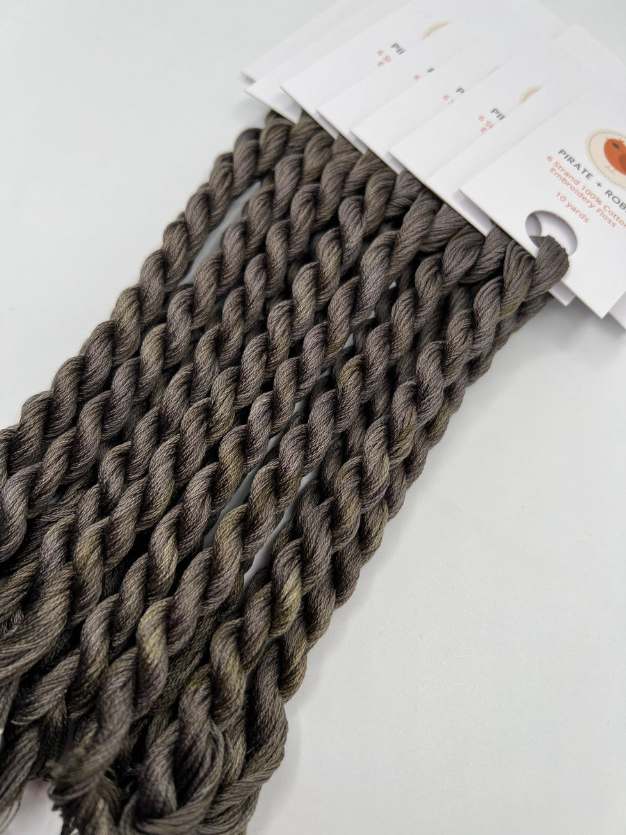 grey braided thread  with a label on a white background