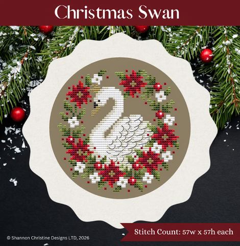 Christmas Swan needlework pattern cover by Shannon Christine Designs, featuring a white swan surrounded by a red, green, and white holiday wreath on a scalloped cream circular design, framed by pine branches and red ornaments.