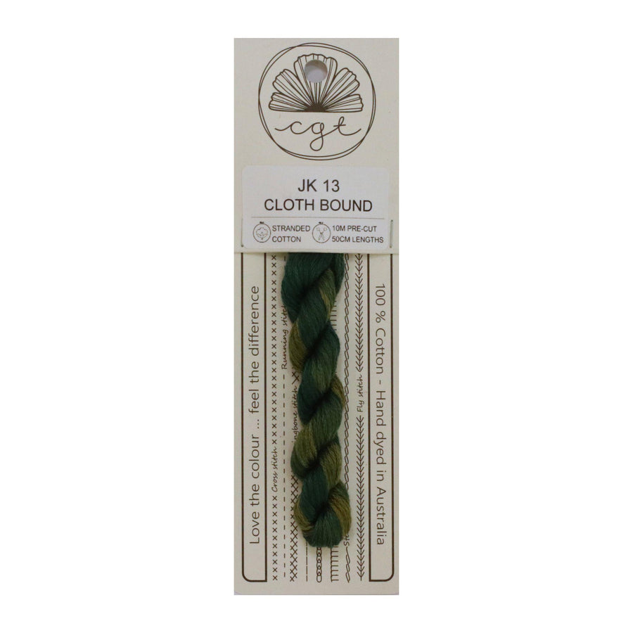 Packaged green thread with a label on a white background