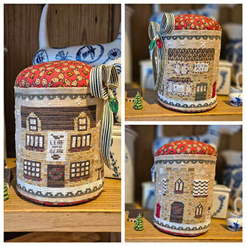 Decorative woven basket with house pattern on a wooden surface