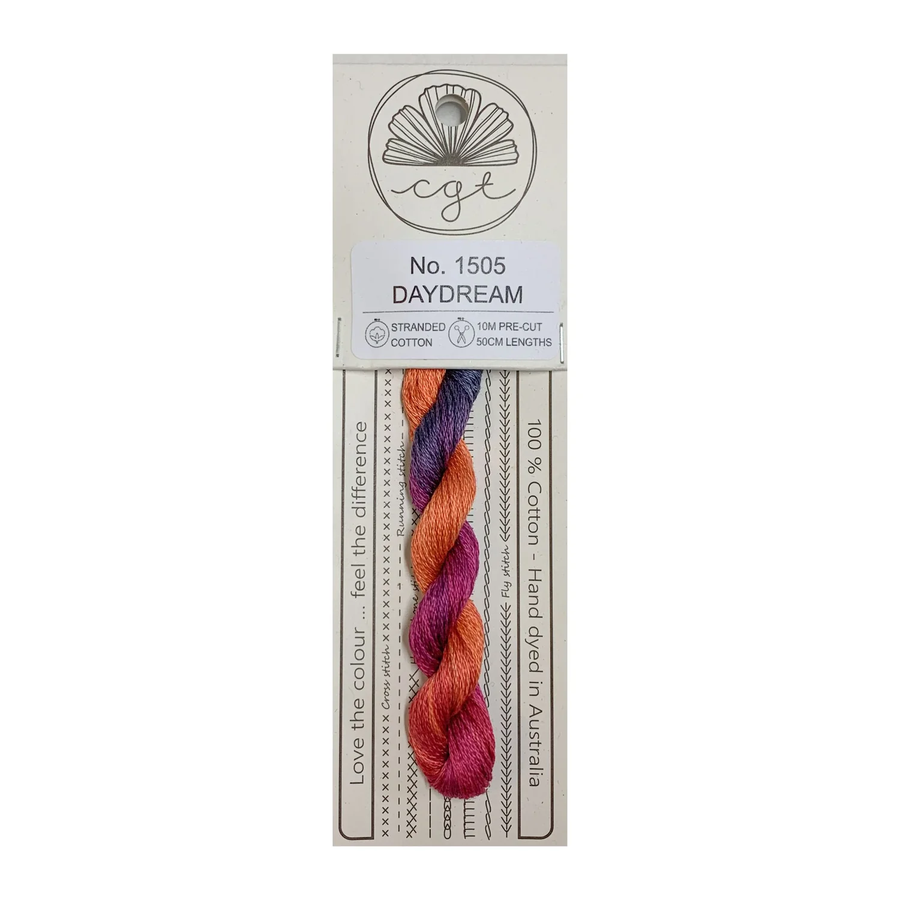 Packaged orange and pink thread with a label on a white background
