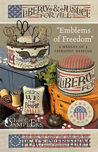 Pattern cover for 'Emblems of Freedom' by Silver Creek Samplers, featuring a patriotic-themed collage of needlepoint designs including an eagle-themed canister, a plaid-covered stool, a pillow reading 'We the People,' and other American flag motifs on a beige fabric-textured background.