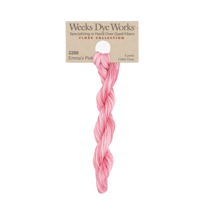 A single twisted bundle of Weeks Dye Works Emma's Pink hand-dyed cotton thread on a kraft paper hanger against a white background.