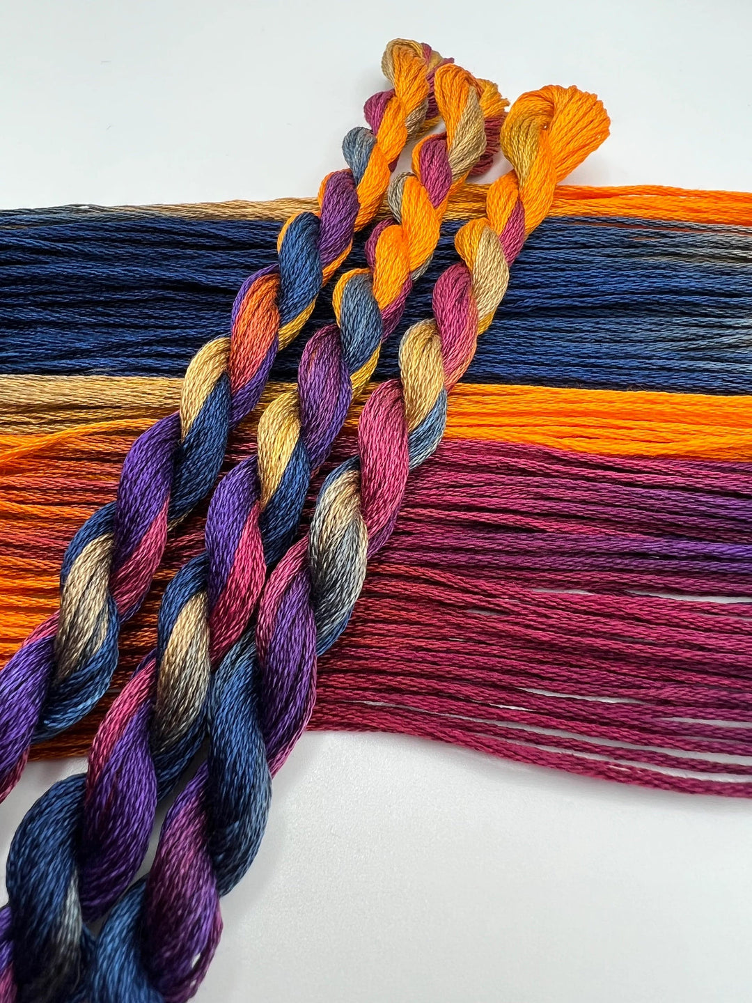 Colorful braided yarn on a white background