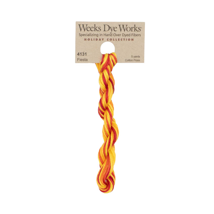 A single twisted cotton fiber bundle in a bright orange and yellow pattern, attached to a kraft paper hanger card from Weeks Dye Works, shown against a plain white background.