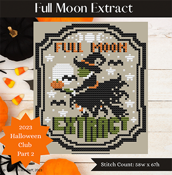 Cross-stitch pattern with a penguin and text 'Full Moon Swimmer' on a wooden surface with Halloween-themed decorations.