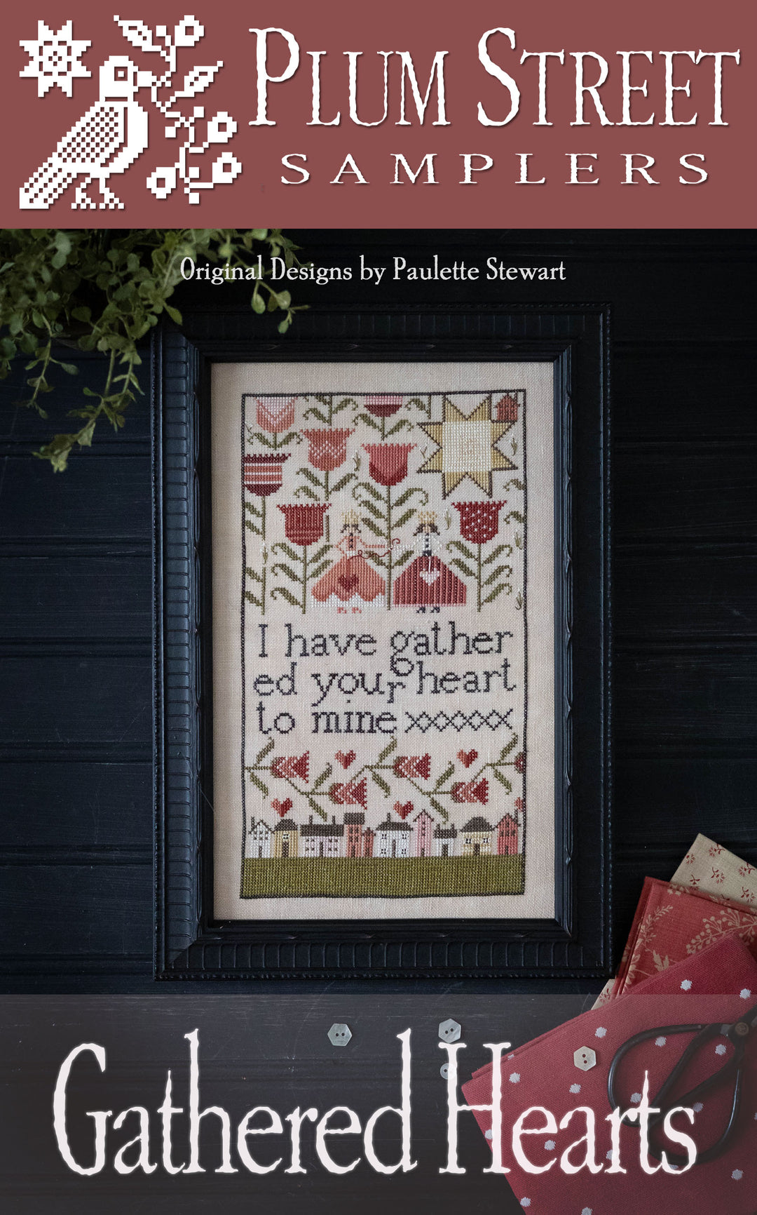 A cross-stitch pattern depicting two friends, flowers, and a row of houses, titled 'Gathered Hearts' by Plum Street Samplers with text reading 'I 