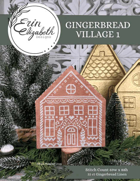 A product cover for a needlework pattern titled 'Gingerbread Village 1' by Erin Elizabeth Designs. The cover features a completed gingerbread house needlepoint in terracotta with white stitching, surrounded by green pine branches and gold-colored gingerbread houses in the background.