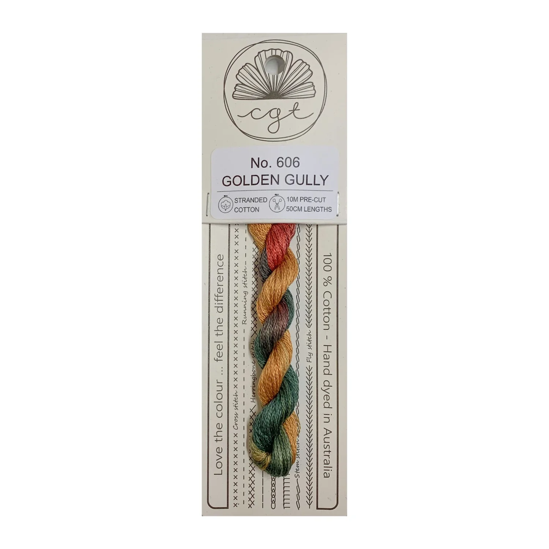 A skein of hand-dyed cotton cross stitch and embroidery floss in multiple colors, labeled 'No. 806 GOLDEN GULLY', from Cottage Garden Threads.