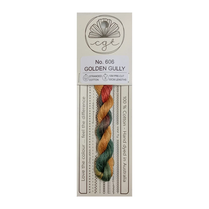 A skein of hand-dyed cotton cross stitch and embroidery floss in multiple colors, labeled 'No. 806 GOLDEN GULLY', from Cottage Garden Threads.