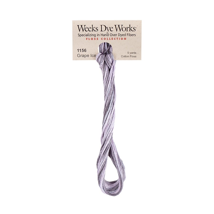 A single skein of Weeks Dye Works Grape Ice cotton embroidery floss attached to a cardboard label, shown against a plain white background.