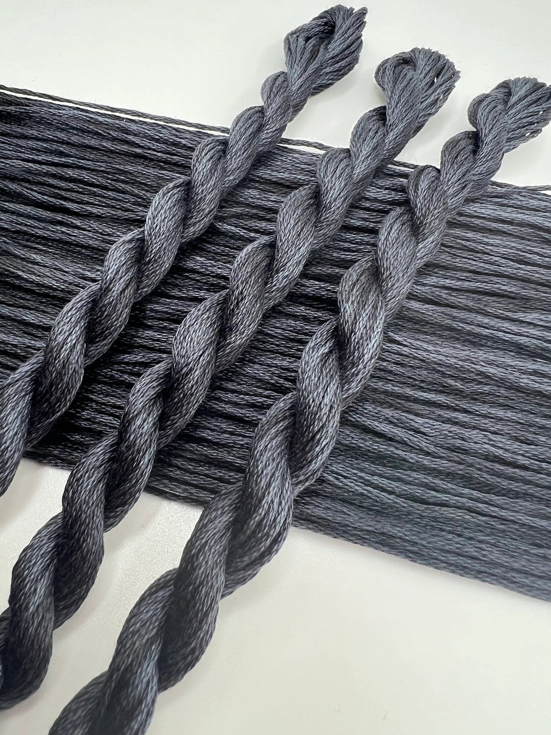 Gray braided yarn on a white background