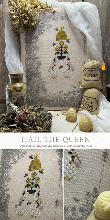 Decorative pillow with embroidered design and text 'Hail the Queen' on a rustic background.