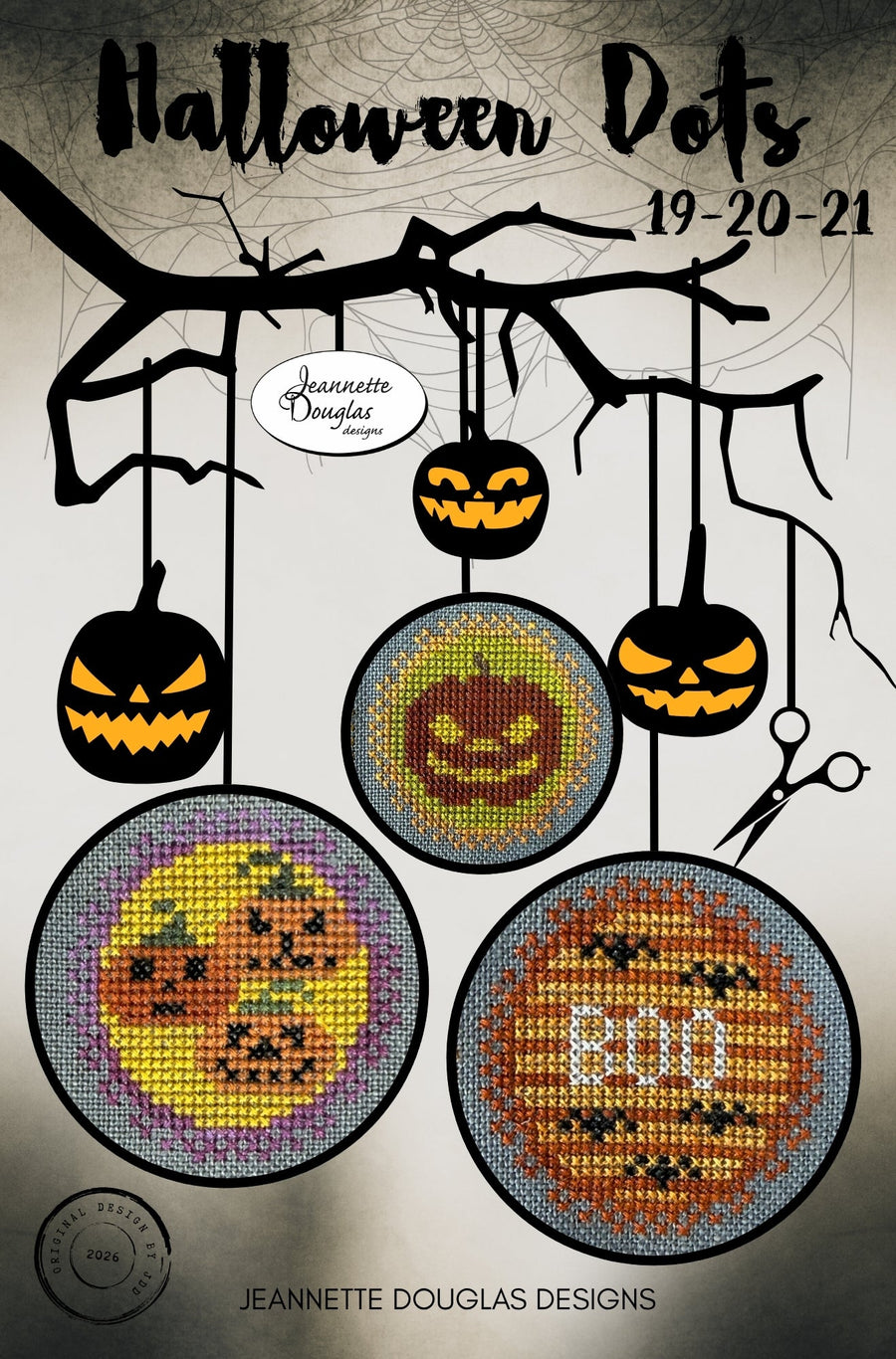 Halloween-themed cross-stitch pattern cover titled 'Halloween Dots 19-20-21' by Jeannette Douglas Designs, showing three circular stitched pumpkin designs hanging from black branches against a gray background.