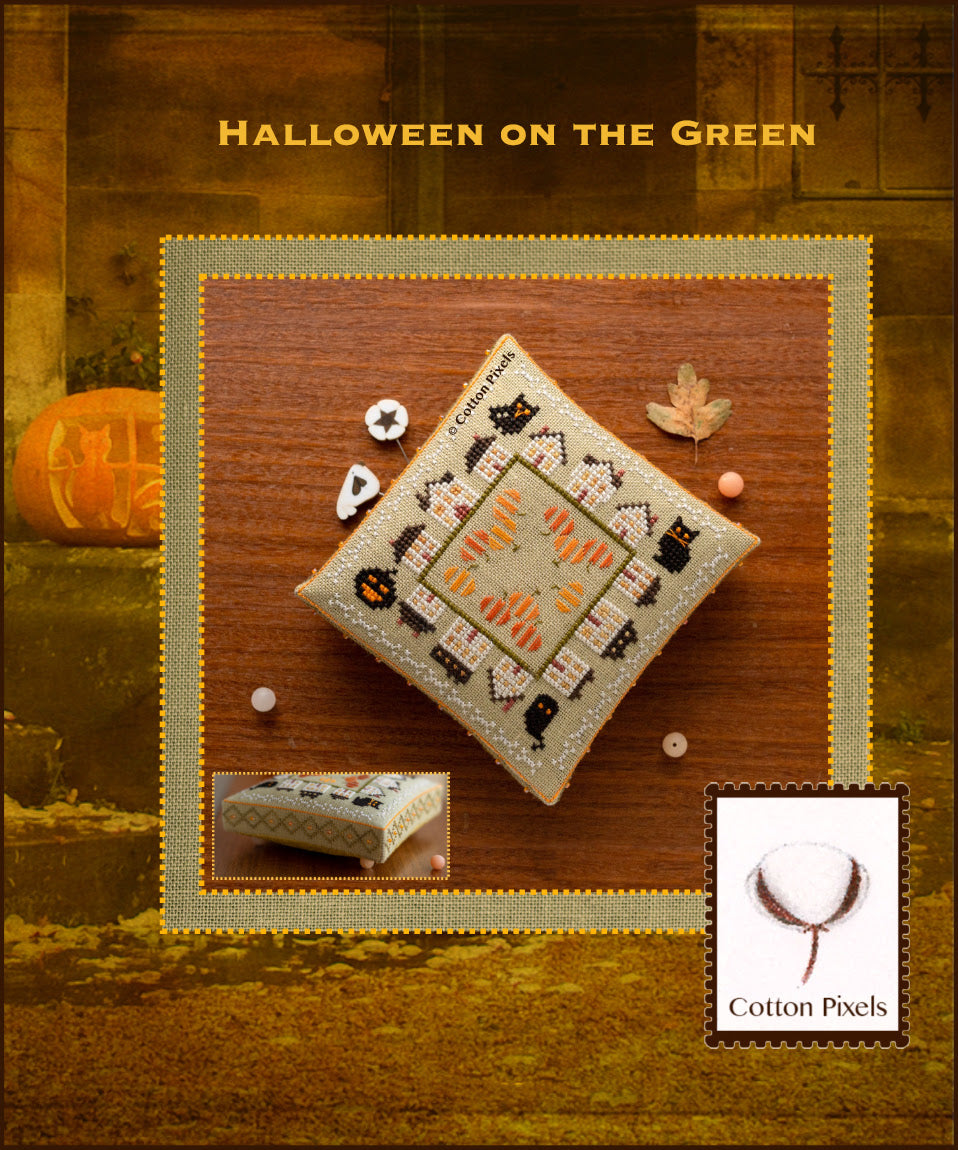 Cross-stitched design on fabric with 'Halloween on the Green' text, featuring a pumpkin and leaf decorations.