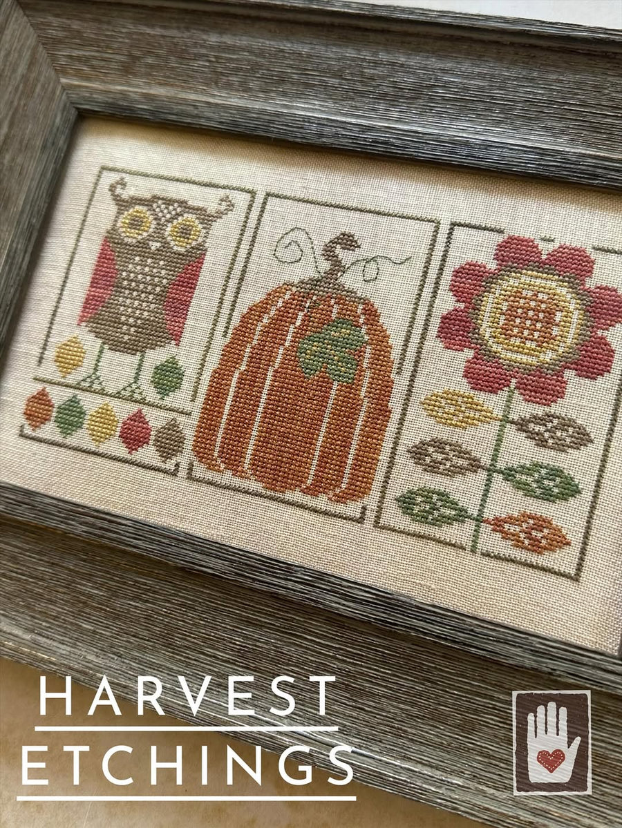 Cross-stitched design with owl, pumpkin, and flower on fabric with 'Harvest Etchings' branding.
