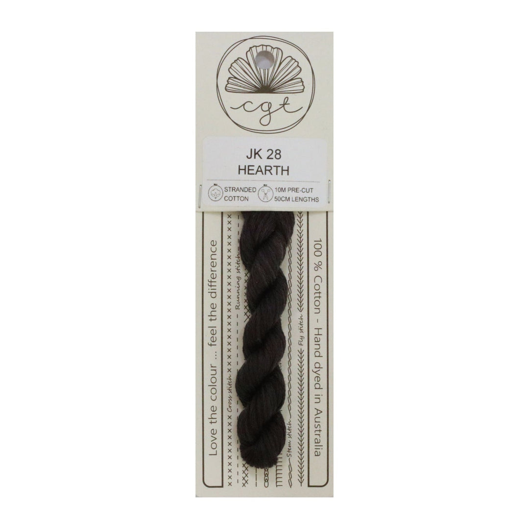 A card with a roll of brown hand-dyed cotton cross stitch and embroidery floss labeled 'JK 28 HEARTH', with the brand logo 'CGT' at the top.