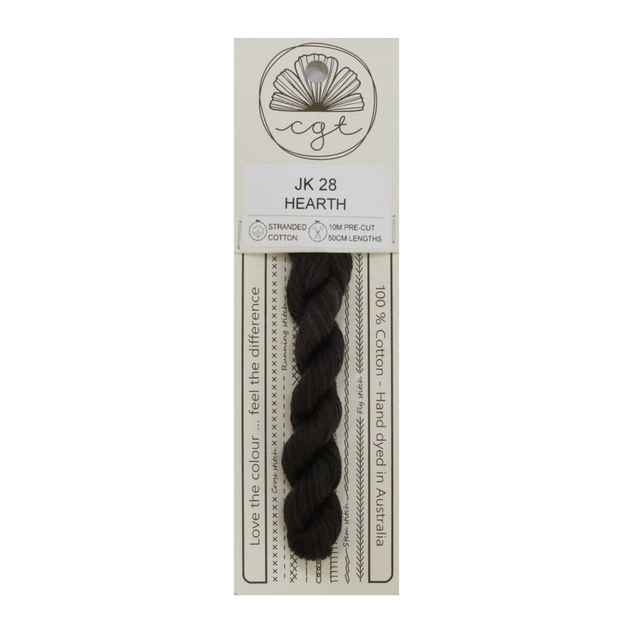 A card with a roll of brown hand-dyed cotton cross stitch and embroidery floss labeled 'JK 28 HEARTH', with the brand logo 'CGT' at the top.