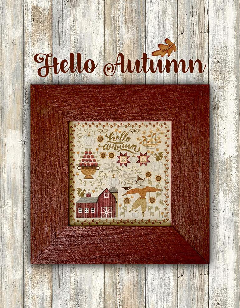 Decorative cross-stitch with 'Hello Autumn' text on a wooden background