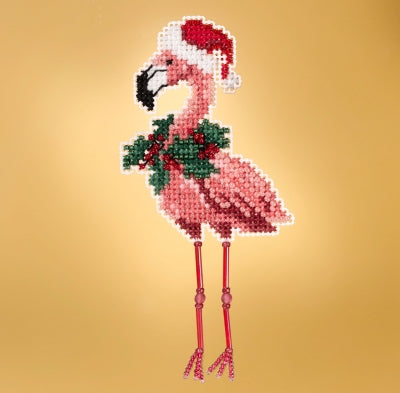 Decorative flamingo with a Santa hat and holly on a gold background