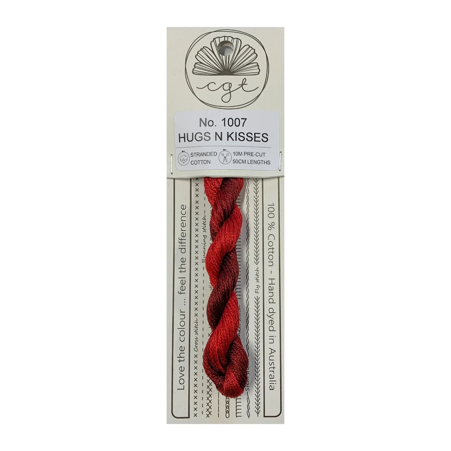 Red thread skein on a white background with packaging labeled 'Hugs N Kisses'.