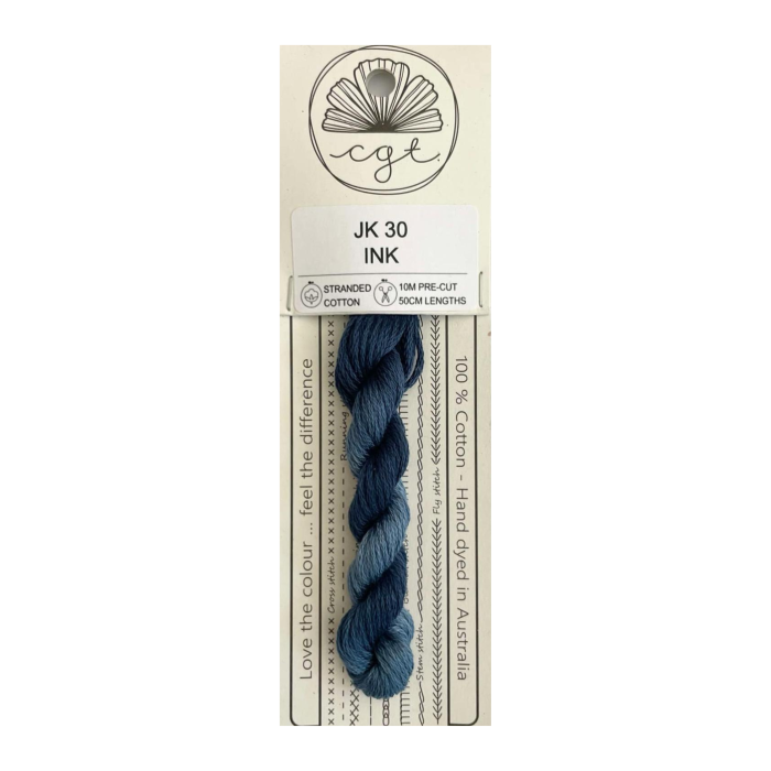 Packaged skein of yarn with a label on a white background