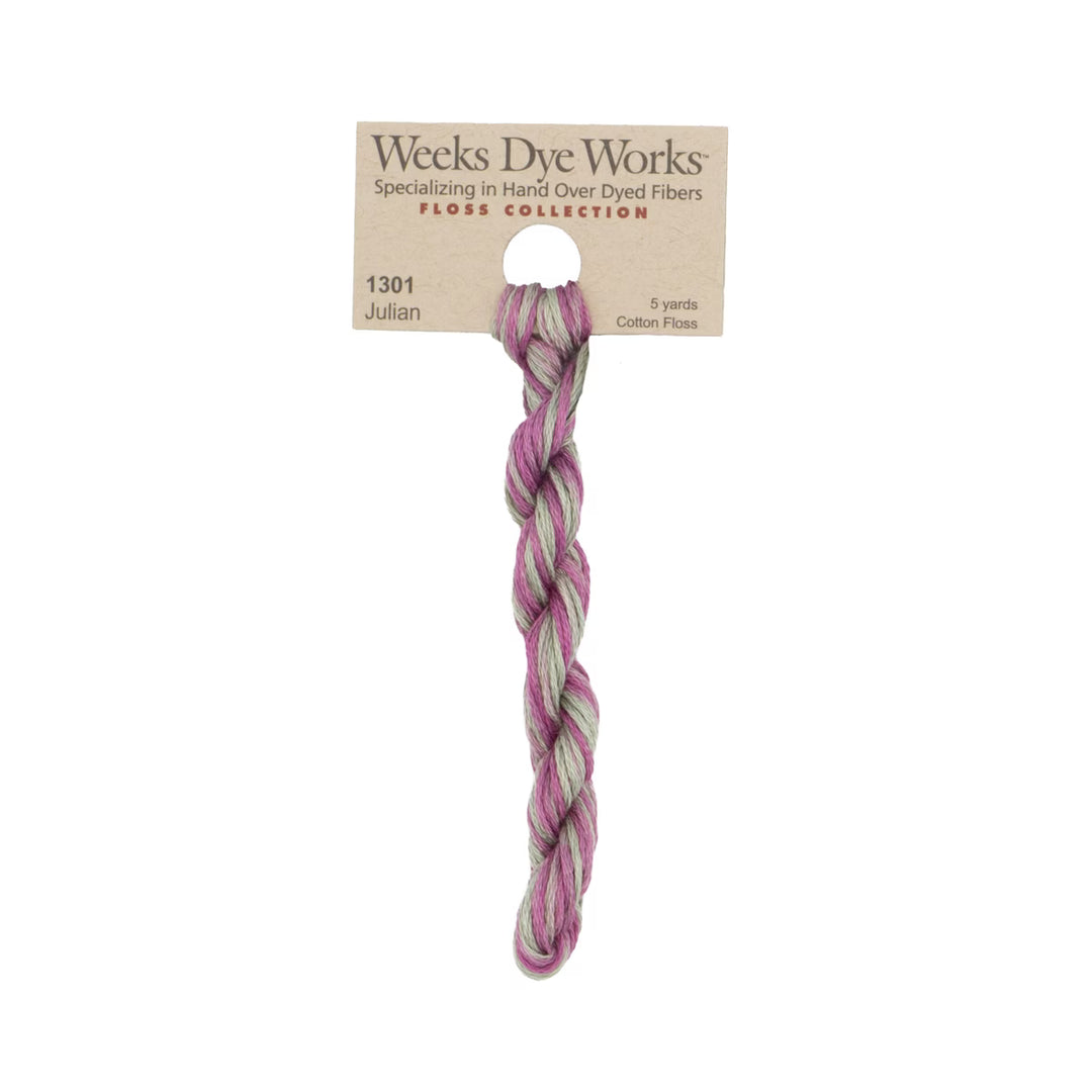 A single twisted bundle of Weeks Dye Works Julian cotton plissé yarn in a pink and light green marbled pattern, attached to its original kraft paper packaging card against a white background.