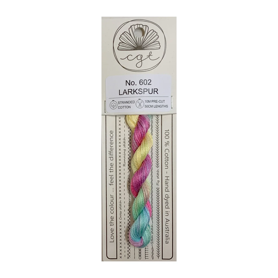 A card with a bundle of pre-cut 6 strand hand-dyed 100% cotton cross stitch and embroidery floss in multicolor, labeled as 'No. 602 LARKSPUR'.