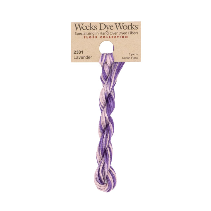 A skein of Weeks Dye Works Lavender hard-dyed cotton thread from the Clover Collection, featuring a light brown paper header card, shown against a plain white background.