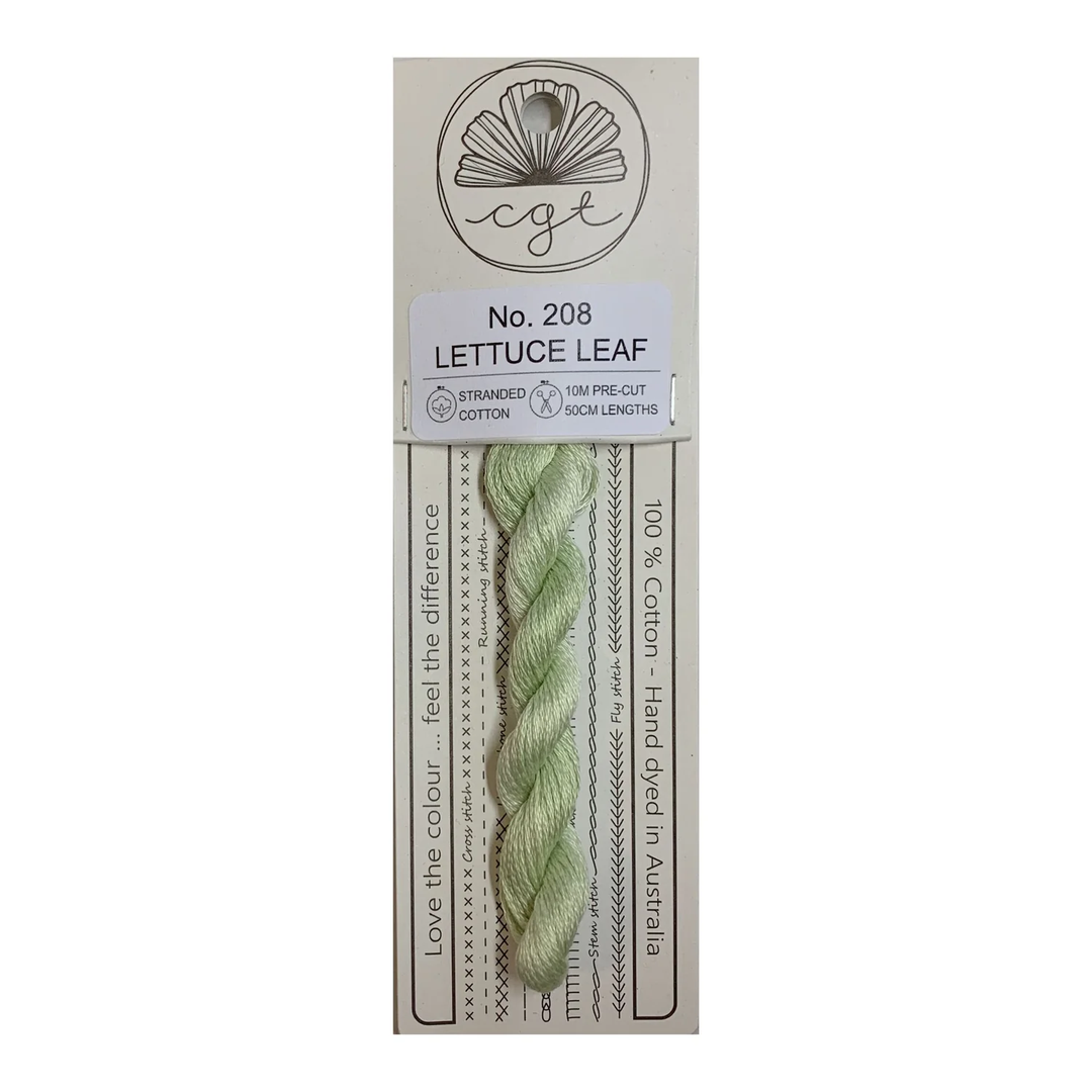 A skein of Cottage Garden Threads lettuce leaf color cotton floss, packaged on a card with branding and product information.